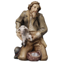Shepherd kneeling with sheep Tyrolean