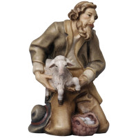 Shepherd kneeling with sheep Tyrolean