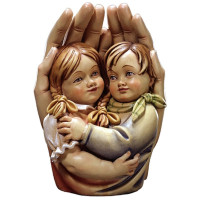 Protective hands with girl and boy