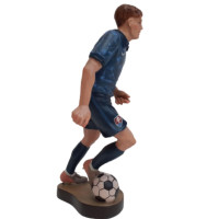 Wooden statue of a football player