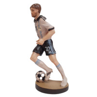 Wooden statue of a football player