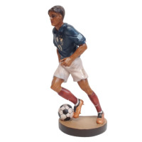 Wooden statue of a football player