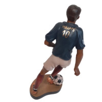 Wooden statue of a football player