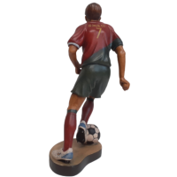 Wooden statue of a football player