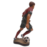 Wooden statue of a football player