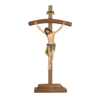Wooden cross curved on piedestal with Corpus Siena