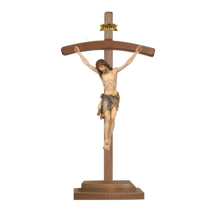 Wooden cross curved on piedestal with Corpus Siena