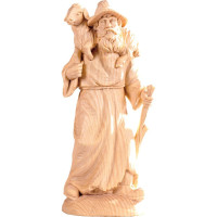 Shepherd with sheep on shoulder - farm made of pine