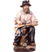 Farmer sitting woodcarving