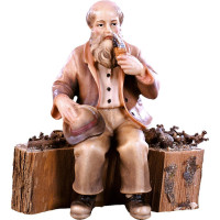 Grandfather sitting on a trunk