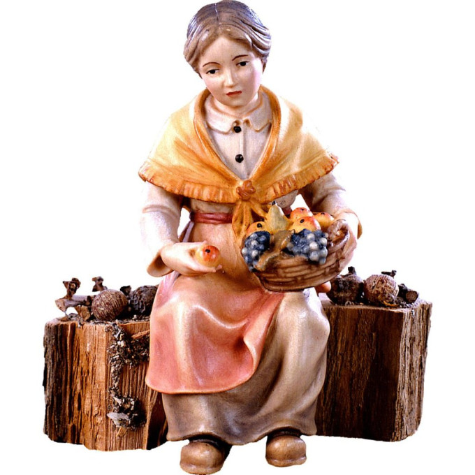 Grandmother sitting on a trunk