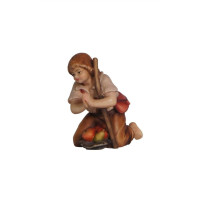Boy kneeling with stick for Nativity scene - Homeland
