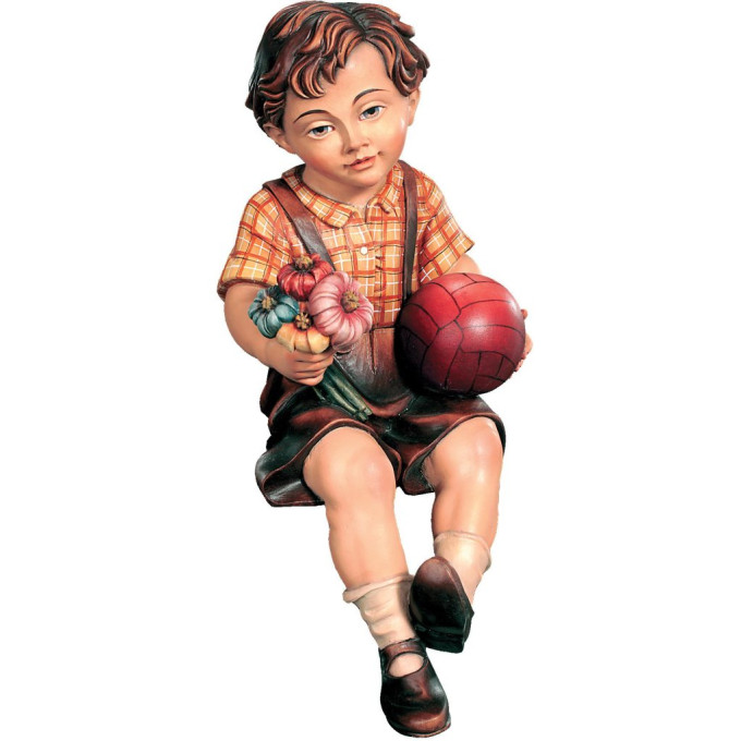 Sitting boy with ball and flower