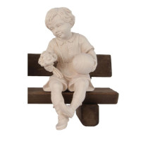 Sitting boy with ball and flower