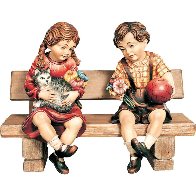Boy and girl sitting on a bench