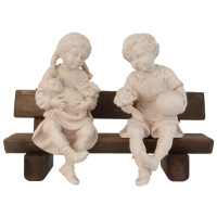 Boy and girl sitting on a bench