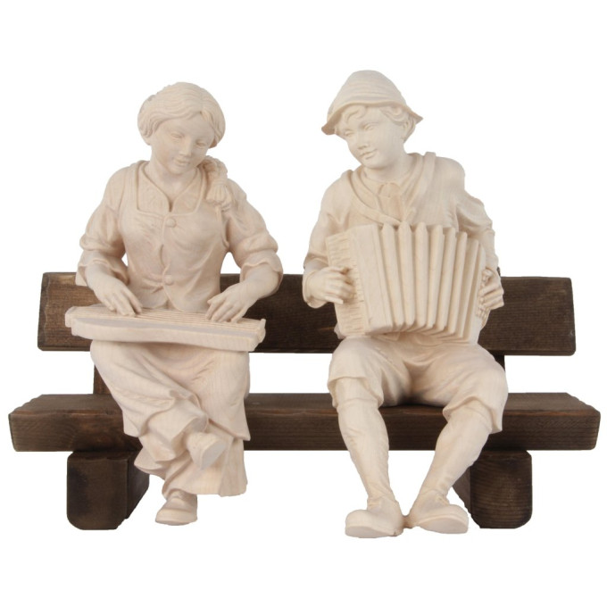 Zither and accordion players sitting on bench