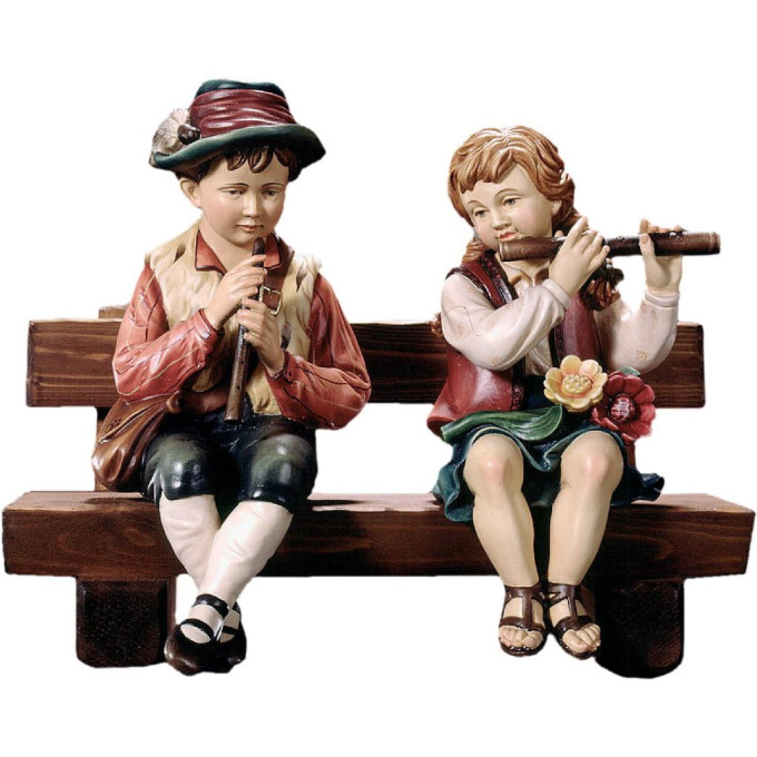 Flute players sitting on a bench