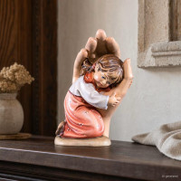 Little girl in protective hand