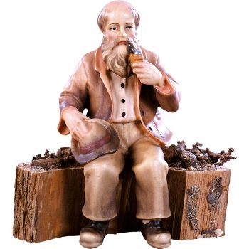 Dedko sediaci na kmeni